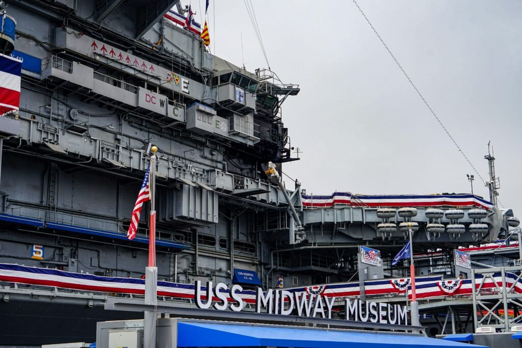 USS MIDWAY MUSEUM a large ship with flags on it